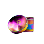 A silver 50mm Tsunami herb grinder with a caved top design, featuring diamond-cut teeth and a kief catcher.