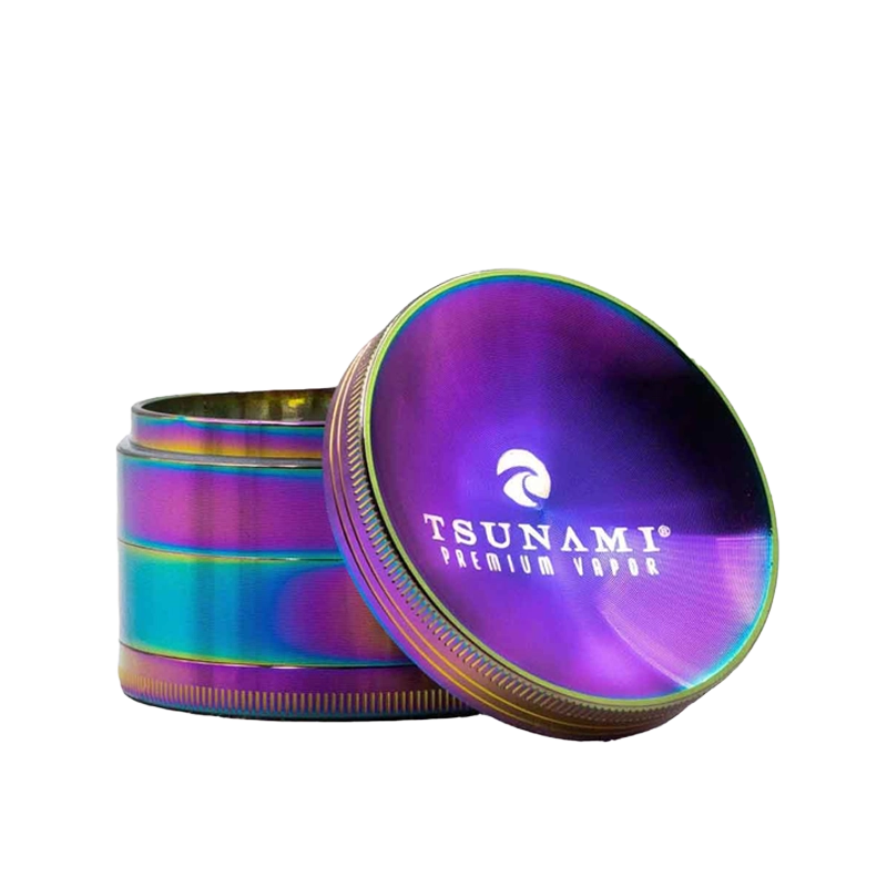 A 63mm Tsunami herb grinder with a distinctive caved top, showing its diamond-cut teeth and four-piece chamber design.