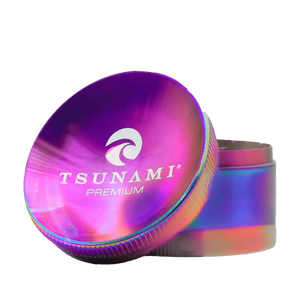 A large 75mm Tsunami herb grinder with caved top design, showing its sharp diamond teeth and multi-chamber construction.