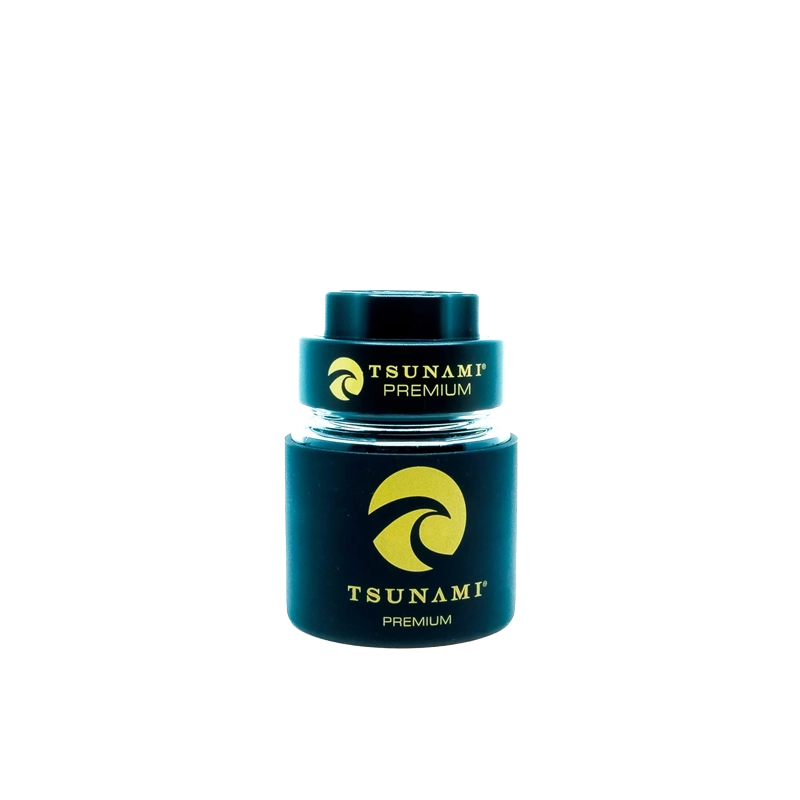 A 60mm Tsunami herb grinder with a clear glass storage jar attached, showing its multi-chamber design and sharp teeth.